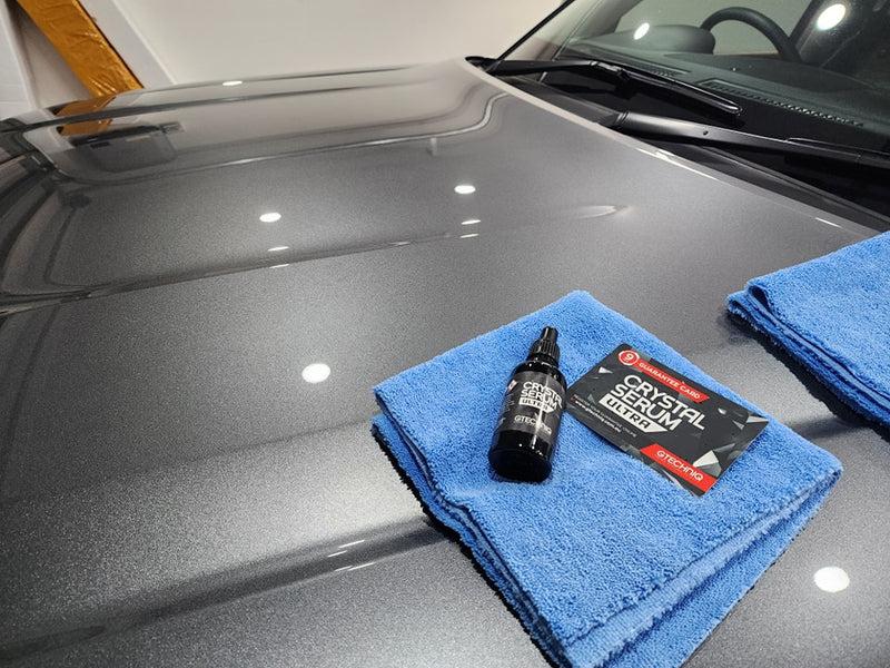 Automotive ceramic coating protecting vehicle surface from chemicals, dirt, and weather damage