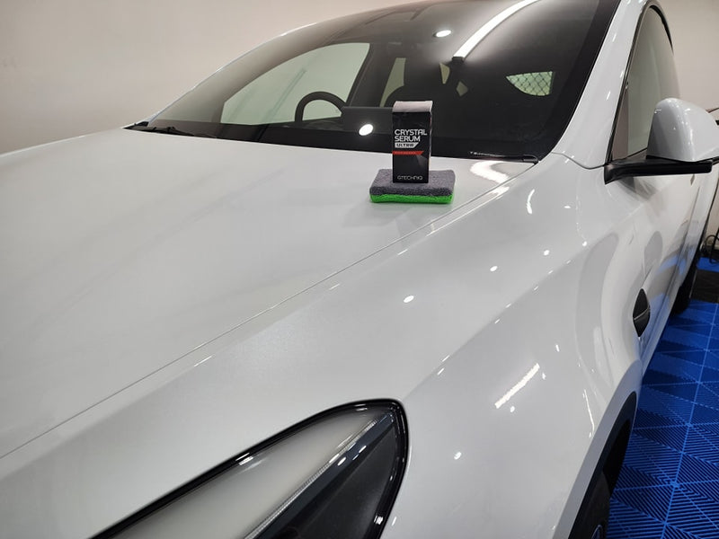 Hydrophobic ceramic coating on car exterior for water beading and long-lasting protection